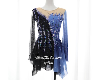 May include: A black and blue figure skating costume with rhinestones and a sheer overlay. The costume has a scoop neck and long sleeves. The text "Wear This Costume @Etsy" is printed on the skirt.