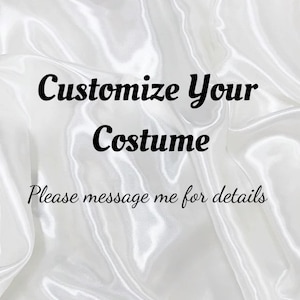 May include: White satin fabric background with the text "Customize Your Costume" in a bold, black script. Below, in a smaller font, it says "Please message me for details". The fabric has soft folds and a shiny texture.
