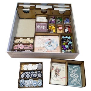 May include: Wooden organiser insert for the board game "Wingspan". The insert has compartments for cards, tokens, and other game components. The insert is made of natural wood and has a light brown finish.