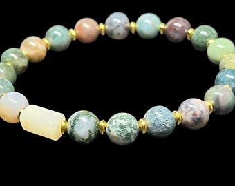 Handcrafted agate beaded bracelet featuring polished natural stones and gold spacer accents.