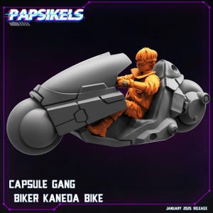 May include: A gray futuristic motorcycle with a rider in an orange outfit. The motorcycle has a large front wheel and angular design. Text on the image reads "PAPSIKELS", "CAPSULE GANG", "BIKER KANEDA BIKE", and "JANUARY 2025 RELEASE".