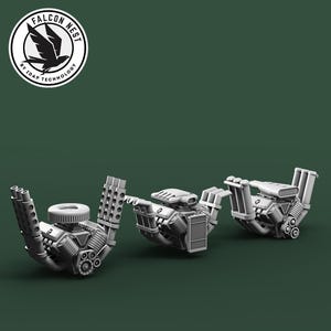 May include: Three grey mechanical components are displayed against a dark green background. The components have intricate details, including tubes, cylinders, and vents. The Falcon Nest logo is in the upper left corner.