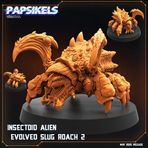 May include: An orange-brown Insectoid Alien model, with the text "INSECTOID ALIEN EVOLVED SLUG ROACH 2" and "MAY 2025 RELEASE". The model has a detailed, textured exoskeleton, large claws, and multiple legs. Several smaller versions are also displayed.