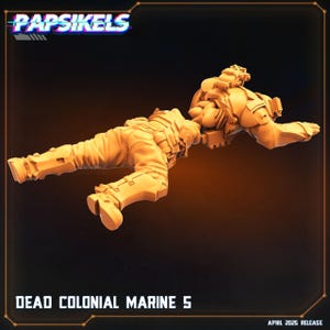 May include: A tan-coloured miniature figure of a fallen soldier, part of the "Dead Colonial Marine 5" series. The figure is in a prone position, with detailed armour and gear. The image includes the "Papsikels" logo and the text "April 2025 Release."