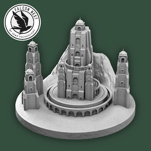 May include: A gray 3D-printed model of a fantasy castle with multiple towers and a circular base. The model is set against a dark green background, with a logo in the upper left corner that reads "FALCON NEST by IDAP TECHNOLOGY."