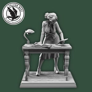 May include: A grayscale figurine of a woman standing behind a desk with books and a lamp. The figurine is wearing a dress and blazer. The Falcon Nest logo is in the upper left corner.
