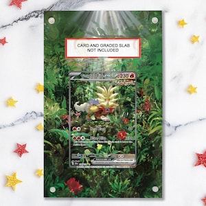 May include: A clear acrylic display featuring a Pokémon card with a Gouging Fire EX design. The card is set against a jungle-themed background with red and yellow flowers. The text "CARD AND GRADED SLAB NOT INCLUDED" is visible.