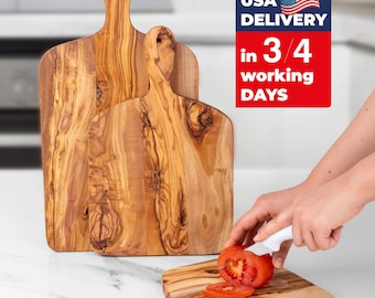 May include: Wooden cutting boards with handles, featuring a natural wood grain pattern. One board is smaller and in use, with a tomato being sliced. The image includes the text "USA DELIVERY in 3/4 working DAYS".