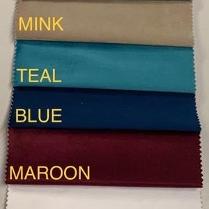 May include: A fabric swatch card displaying 14 different colours of plush fabric. The colours are: steel, silver, grey, black, mustard, duck egg, mink, teal, blue, maroon, white, pink, matt, and cream. The card is labelled "Plush Fabric Colours".