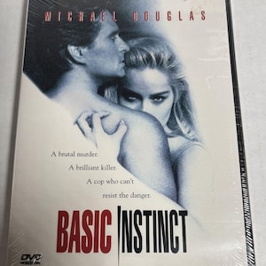 May include: Sealed DVD of the film "Basic Instinct" featuring Michael Douglas and Sharon Stone. The cover art shows a man and woman in a close embrace, with the film's title in bold red letters. Text on the cover reads: "A brutal murder. A brilliant killer. A cop who can't resist the danger."