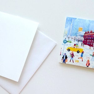 Puede incluir: Una tarjeta con una escena de invierno con un edificio de ladrillo rojo, un taxi amarillo y personas caminando en la nieve. La tarjeta tiene un fondo blanco y el número 9 en la esquina inferior derecha.