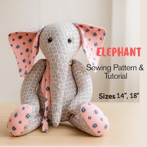 May include: A handmade stuffed elephant with large ears and a trunk. The elephant is gray with a repeating pattern and pink accents. The ears and feet are pink with a blue floral design. The text "ELEPHANT Sewing Pattern & Tutorial" is visible, with sizes 14" and 18".