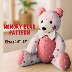 May include: A handmade Memory Bear pattern in sizes 14" and 18". The bear is pink and lavender with white star patterns and a red center. It has a white bow tie and black button eyes. The text "MEMORY BEAR PATTERN" is in red.