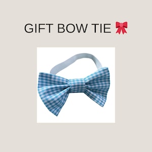 May include: A blue and white gingham bow tie with a white elastic band. The text "GIFT BOW TIE" is above the bow tie, with a red bow emoji to the right.