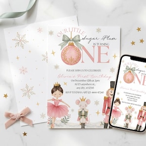 May include: A birthday invitation card and a smartphone displaying the same design. The invitation features a pink ornament, a ballerina, a mouse, and a nutcracker with the text Our Little Sugar Plum Is Turning One and event details.