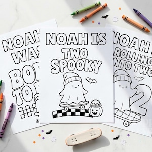 May include: Three white coloring pages with black outlines featuring ghosts on skateboards and text including Noah is Two Spooky, Noah was Born to Rock, and Noah is Rolling into Two, surrounded by scattered colorful crayons and a toy skateboard.