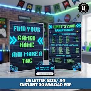 May include: Two acrylic signs with gaming-themed text. One says "Find Your Gamer Name and Make a Tag" in teal and green. The other says "What's Your Gamer Name?" with a name generator. A small tag reads "My Gamer Name Is..." and "Stealth Blaster from Planet Pixel".