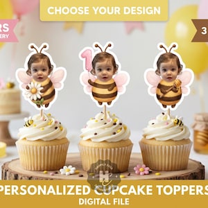 May include: Three cupcakes with white frosting, each topped with a personalized bee-themed topper featuring a baby's face. The toppers have wings and are on wooden sticks. The image includes text that says "CHOOSE YOUR DESIGN" and "PERSONALIZED CUPCAKE TOPPERS DIGITAL FILE".