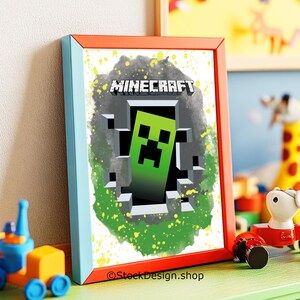 May include: Framed Minecraft artwork featuring a green Creeper character emerging from a pixelated hole. The artwork has a blue and orange frame, with a green and gray background. The word "MINECRAFT" is at the top. The image is on a green surface.