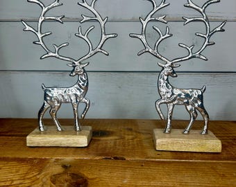 Pair of silver sculpted reindeer