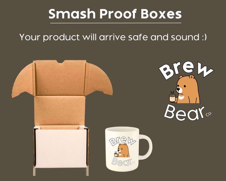 May include: An open cardboard shipping box with a white exterior and brown interior, positioned next to a white ceramic mug featuring a cartoon bear holding a cup and the text Brew Bear co. The image includes the text Smash Proof Boxes.