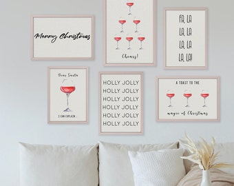May include: Set of six printable Christmas-themed wall art prints featuring wine glasses with red wine and festive text. The prints include "Merry Christmas", "Dear Santa I Can Explain", "Holly Jolly", "A Toast to the Magic of Christmas", "Cheers!" and "Fa La La La La La!"