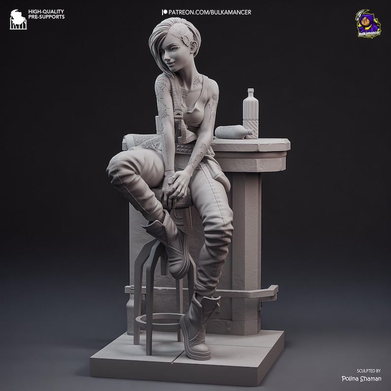 May include: A detailed 3D-printed figurine of a woman seated on a stool, with tattoos on her arms and a bottle on a nearby surface. The figurine is in a neutral color, with the text "PATREON.COM/BULKAMANCER" visible.