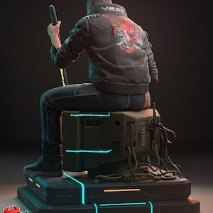 May include: A detailed sculpture of a figure seated on a futuristic platform. The figure wears a black jacket with a red and white design on the back. The platform has neon blue and orange accents. The figure holds a black sword.