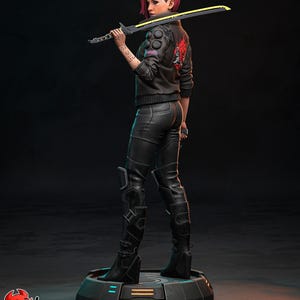 May include: A figurine of a character with pink hair, wearing a black jacket with a red design, black pants, and boots, holding a yellow-and-black sword. The figure stands on a circular platform. The image has the text "PATREON" and "H3LL CREATOR".