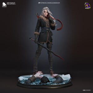May include: A detailed figurine of a white-haired character wearing a black coat with fur trim, dark gloves, and a red scarf. The character holds a long sword and stands on a circular base featuring a figure emerging from icy blue water.
