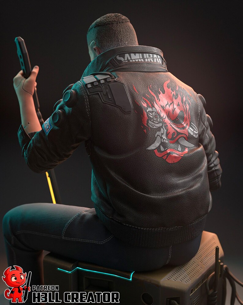 May include: A black leather jacket with the word "SAMURAI" on the collar and a red and gray graphic on the back. The jacket is worn by a person sitting on a box, holding a black device.