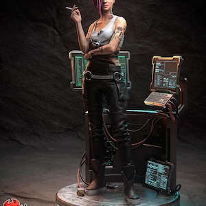 May include: A futuristic figurine of a person with green and purple hair, wearing a white tank top, black pants, and boots. The figure is holding a cigarette and is standing on a platform with computer screens and a keyboard. The base of the platform has a neon light. The text "PATREON H3LL CREATOR" is visible.