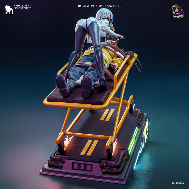 May include: A detailed figurine depicting a futuristic scene. A figure in a white jacket and black leggings leans over a person strapped to a yellow stretcher. The stretcher is on a platform with neon accents. The base is purple and black.