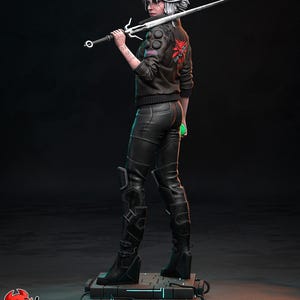 May include: A detailed figurine of a character from The Witcher series, holding a silver sword. The figure wears a black jacket with a red emblem, black pants, and boots. The base has blue neon accents. The figurine is a collectible item.