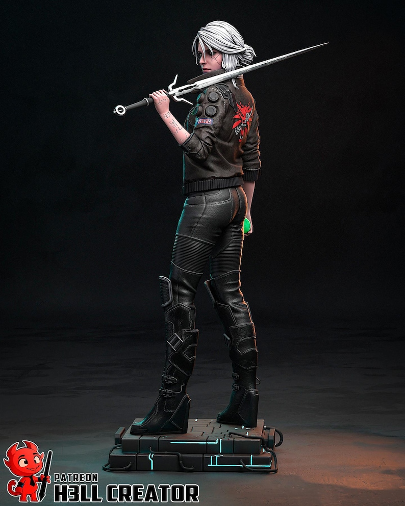 May include: A detailed figurine of a character from The Witcher series, holding a silver sword. The figure wears a black jacket with a red emblem, black pants, and boots. The base has blue neon accents. The figurine is a collectible item.