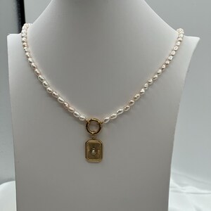 Rice pearls and a sunburst pendant necklace.
