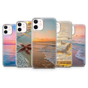 May include: Set of five clear phone cases with different beach sunset and seascape designs. The cases feature a starfish, a seagull, and a variety of ocean colors.