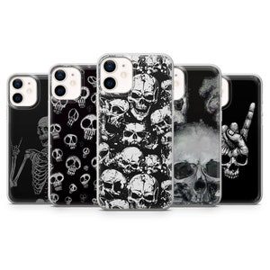 May include: Five different iPhone cases with skull designs. The cases are clear and show the phone's design through the case. The skull designs are black and white.