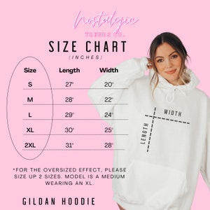 May include: A size chart for a Gildan hoodie, with measurements in inches. The chart includes sizes S to 2XL, with corresponding length and width dimensions. The image also features the text "Nostalgic Trends Co."