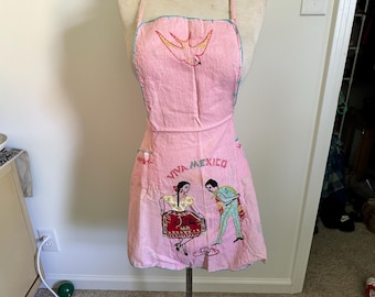 Vintage Mexican apron 1940&#39;s hand embroidered pink apron dress depicting charro dancing couple