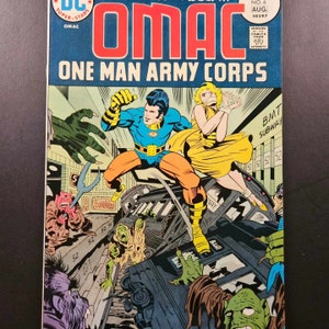 May include: A comic book cover featuring a superhero in a blue and orange costume fighting monsters on a subway train. The cover text reads "OMAC ONE MAN ARMY CORPS".