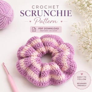 May include: A handmade crochet scrunchie in shades of purple and light pink, with a striped pattern. The image also features a ball of yarn, a crochet hook, and text that reads "CROCHET SCRUNCHIE Pattern" and "PDF DOWNLOAD INSTANT ACCESS".