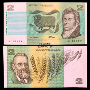 May include: Two Australian dollar banknotes. The top bill features a sheep and a portrait. The bottom bill shows a portrait and wheat. The text "EXTREME BANKNOTES AUSTRALIA" is visible.
