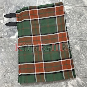 May include: A green, orange, brown, and white plaid kilt with a black leather strap and buckle.