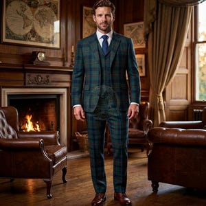 May include: A three-piece suit in a dark green and navy blue plaid pattern, consisting of a single-breasted blazer with notched lapels, a matching button-up vest, and tailored trousers, worn with a crisp white dress shirt and a blue necktie.