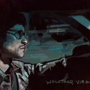 May include: A man wearing glasses drives a car at night. The text "WOLFTTRAP, VIRGINIA" is visible in the lower right corner of the image.