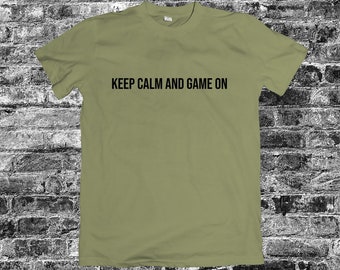 Blijf kalm en speel op T-shirt Unisex