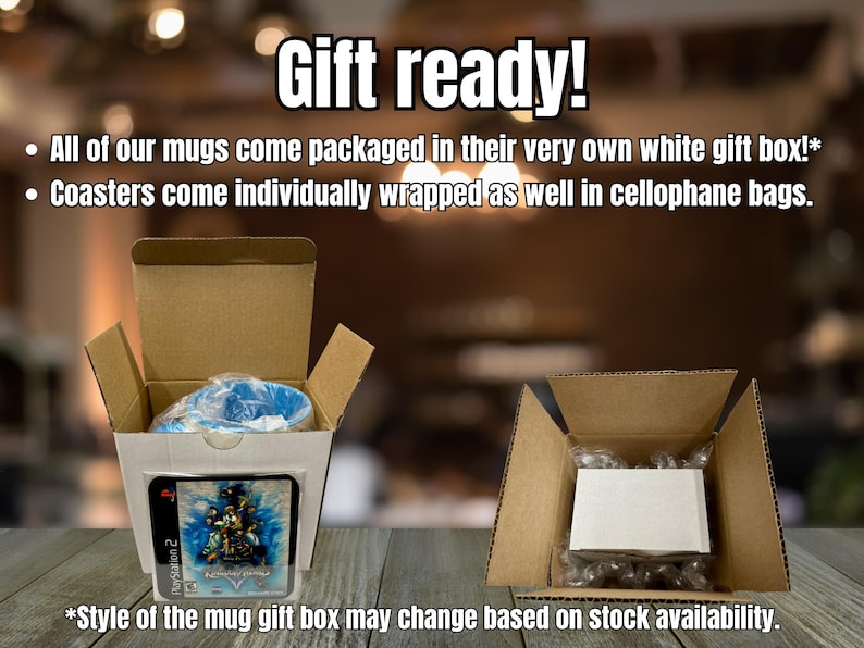 May include: Two open cardboard boxes, one containing a blue mug wrapped in plastic with a square coaster featuring a blue graphic print in front, and the other containing a white box. Text reads: Gift ready! All of our mugs come packaged in their very own white gift box!* Coasters come individually wrapped as well in cellophane bags. *Style of the mug gift box may change based on stock availability.