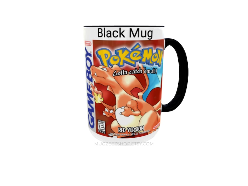 May include: A black ceramic mug featuring the Nintendo Game Boy Pok&eacute;mon Red Version video game cover art. The design includes the orange Charizard character, the Pok&eacute;mon logo, the text Gotta catch 'em all!, and the ESRB E rating symbol.
