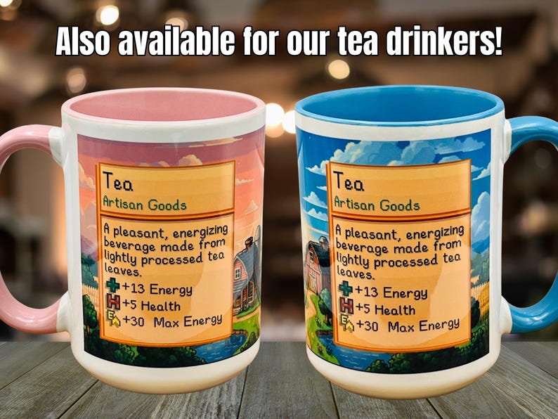 May include: Two ceramic mugs with colorful designs. One mug has a pink handle and interior, the other has a blue handle and interior. Both mugs feature a label with the word "Tea" and a description of the beverage.